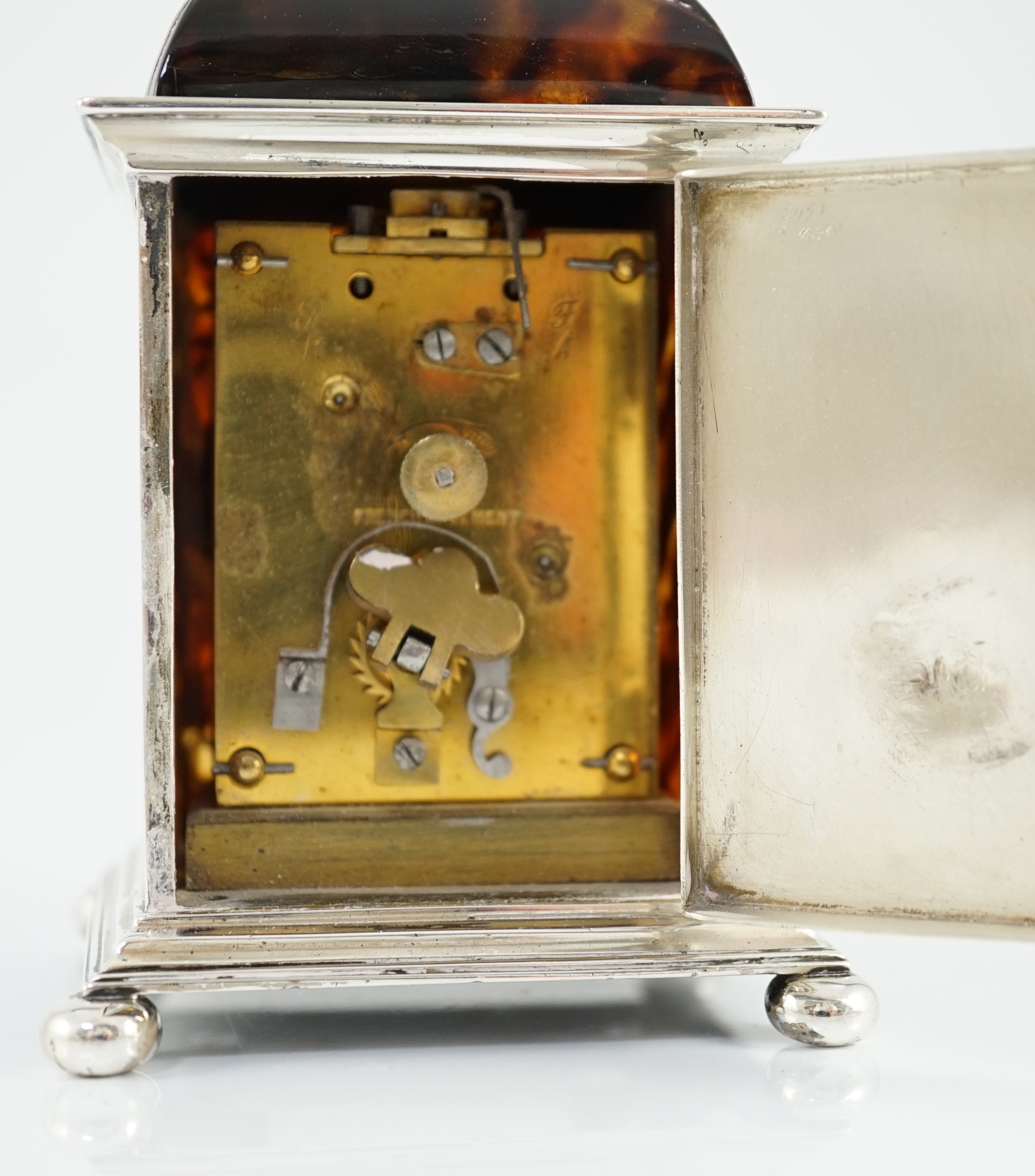 A George V silver and tortoiseshell pique mounted carriage timepiece, by William Comyns